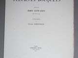 the front cover of a book with a black and white image of flowers