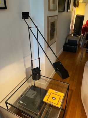 a lamp that is sitting on a table in a room