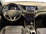 the interior of a car with a steering wheel, dashboard, and dashboard controls