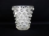 a clear glass vase with a lot of bubbles on it
