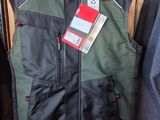 men ' s vests and jackets hanging on a rack in a store