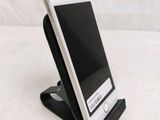 a cell phone that is sitting on a stand