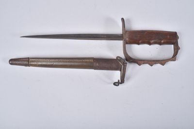pair of old and rusty knifes on a white surface