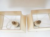 two lamps that are sitting on a white table