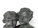 statue of a couple of cherenshes holding each other