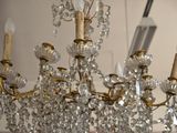 a chandelier that has a lot of crystal hanging from it
