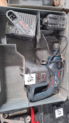 a box with tools in it that is sitting on the floor