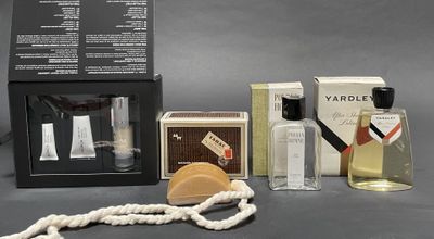 a bottle of perfume and a box of soap on a table