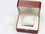 a box with a ring inside of it on a white surface
