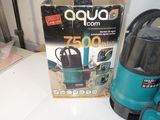 a blue and black vacuum on a table next to a box of vacuum cleaners