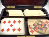 a wooden box with cards and other items in it