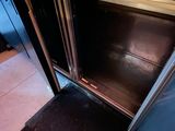 an open door to a stainless steel oven in a kitchen