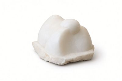 marble figurine of a white cat on a white background