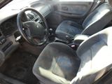 a picture of a car interior with a steering wheel and dashboard