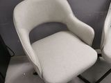 two chairs sitting next to each other in a room