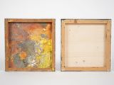 two wooden frames with a painting on them sitting next to each other