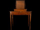 an old wooden dressing table with a mirror on top of it