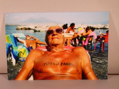 a picture of a man with a tattoo on his chest