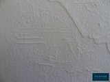 a drawing on the wall of a building with a train on it