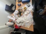 a messy desk with a lot of clutter on it