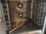 an open oven that is sitting on a table