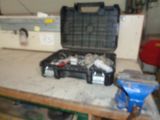 a tool box sitting on a workbench in a garage