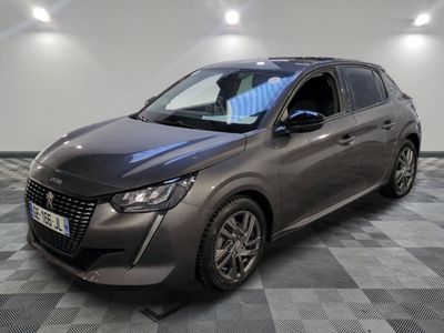 the grey car is parked on a checkered floor in a room