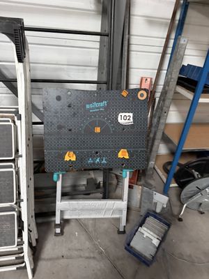 a suitcase sitting on top of a cart in a garage