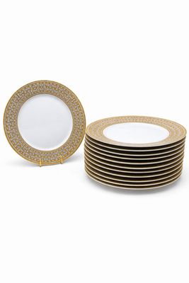 un lot de six assiettes plates dorées et blanches
