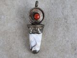 sterling silver pendant with red coral in the center