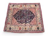 an antique persian rug with a geometric design on a white background