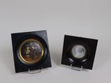 pair of black and gold miniature plates with flowers on them