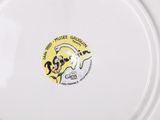 a white plate with a picture of a dog on it