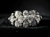 a close up of a cluster of diamonds on a black surface