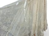 an image of a dress on a mannequin stand on a white background