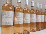 several bottles of wine are lined up on a table