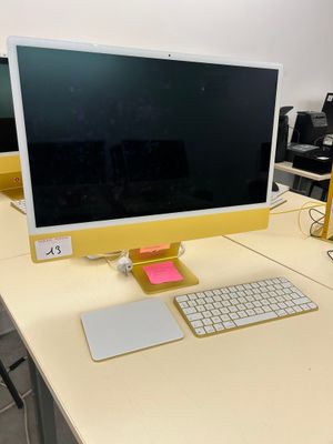 a computer on a desk with a keyboard and mouse