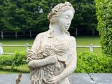 a statue of a woman holding a baby in her arms