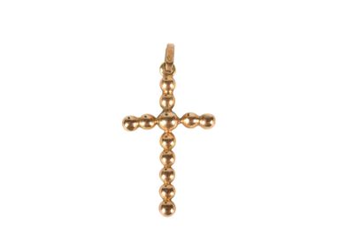 a gold cross pendant on a white background