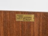 a plaque on the side of a wooden box