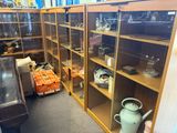 many shelves with tea pots and teapots on them