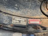 a close up of a car ' s front bumper with a sticker on it