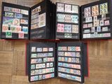 a lot of stamps in a folder on the floor