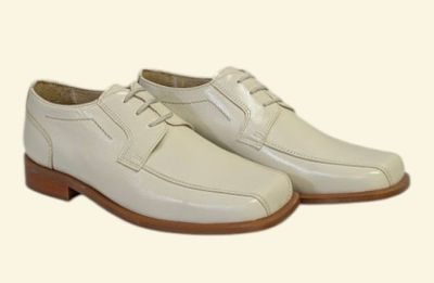 men ' s white dress shoes with brown soles on a white background