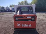 a picture of a bobcat truck parked in a lot