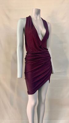the mannequin is wearing a red dress with a deep v neckline