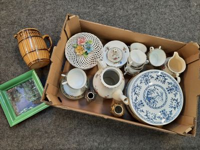 a cardboard box with a lot of different items in it