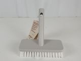a close up of a brush with a tag on it