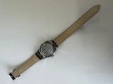 an image of a watch sitting on top of a white table
