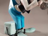 mickey mouse figurine holding a baseball bat and wearing blue pants
